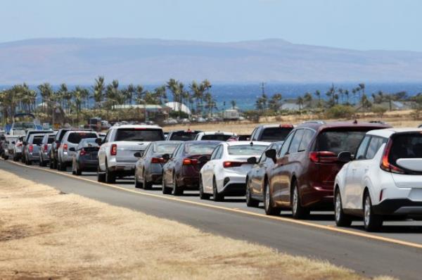 Vehicles are seen in traffic on Ho<em></em>noapiilani Hwy after officials allowed residents and tourists back into West Maui after a wildfire destroyed the historic town of Lahaina, in Maui, Hawaii, U.S. August 11, 2023. REUTERS/Marco Garcia