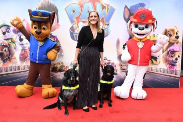 Siobhan Meade picitured with guide dogs at Paw Patrol movie premiere