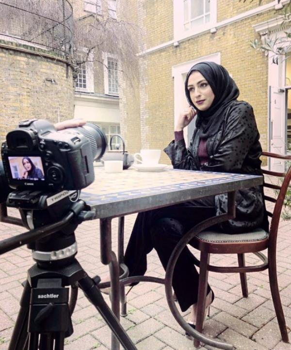 Bushra being filmed wearing the hijab