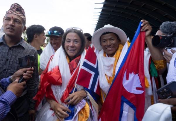 epa10785296 Norwegian climber Kristin Harila (L) and expedition member Tenjen Sherpa (R) are welcomed at Kathmandu Airport in Kathmandu, Nepal, 05 August 2023. Norwegian climber Kristin Harila and Tenjen (Lama) Sherpa became the fastest climbers to ascend all 14 peaks above 8,000 meters in 92 days after both scaled the world's second highest peak Mt. K2 in Pakistan on 27 July 2023. EPA/NARENDRA SHRESTHA